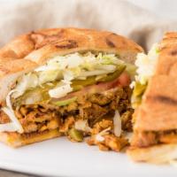 Torta Pollo · Grilled or shredded with sour cream lettuce, avocado, jalapeños, onions and tomato.