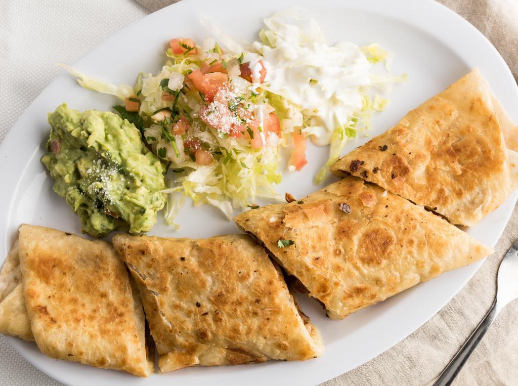 Quesadilla Suiza · Your choice of meat, toasted with jalapeño butter with sour cream, guacamole  and pico de gallo.