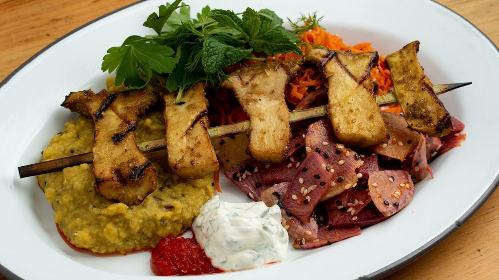 Mushroom Plate · One grilled king trumpet mushroom kebab (marinated in turmeric and coriander), choice of grilled homemade flatbread, or mashed red lentils, choice of two salads, herby yogurt, and spicy pickled chiles. (red lentils are gluten-free)￼.
