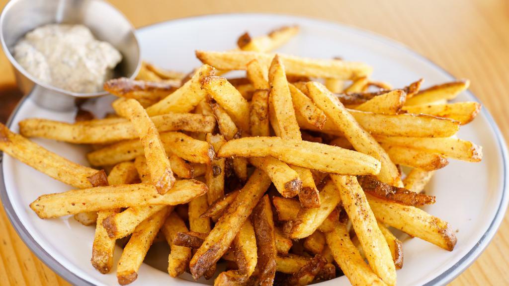 Spiced Fries with Herby Yogurt · Spiced fries with sumac, cumin, coriander, caraway, and cayenne. (fried in rice bran oil). Served with herby yogurt on the side