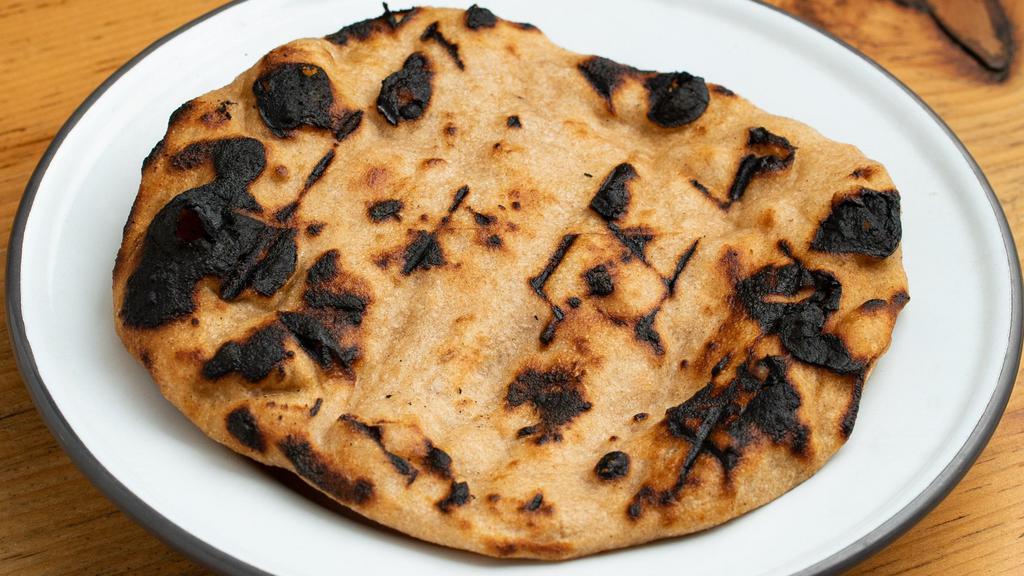 Flatbread · One piece of grilled homemade flatbread.