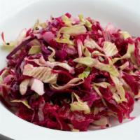 Sauerkraut Salad · Homemade sauerkraut and raw red cabbage with popped mustard seeds. VEGAN