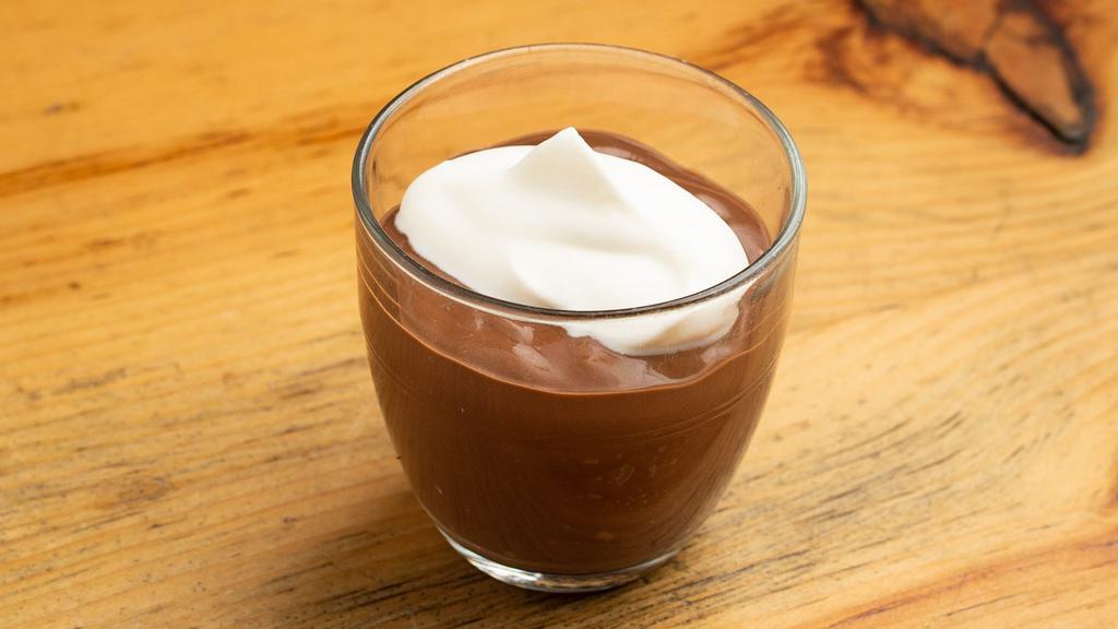 Chocolate Pudding · Homemade chocolate pudding with whipped cream. 
 Vegetarian.