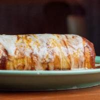 Super Mojado Burrito · A large flour tortilla stuffed with your choice of meat, rice, beans, cheese, sour cream, le...