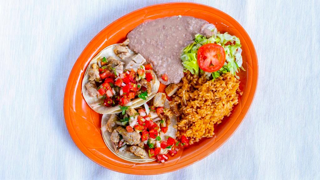 Soft Taco Plate · Two soft corn tortillas stuffed with your choice of meat and pico de gallo. Served with rice and beans.