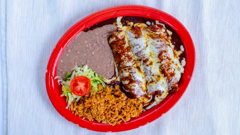 Enchiladas Plate · By far our most popular dish! Three corn tortillas stuffed with your choice of chicken, beef, or cheese and smothered with our award-winning red mole and melted cheese.