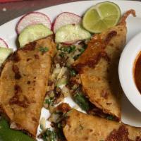 Quesabirria  · Tortilla dipped in birria sauce. Then cooked until crispy, with a cheesy and birria filled c...