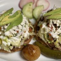 Sopes · 2 with your choice of meat, avocado, sour cream, cheese and our specialty pico de gallo.