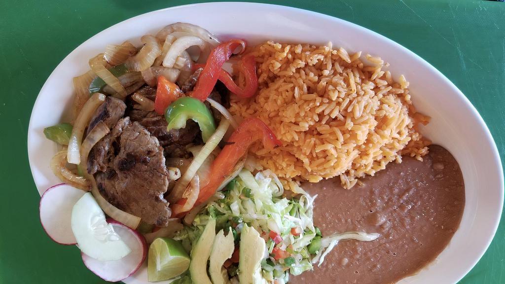 Orden de Carne Asada · Steak Plate with a side of rice, beans, avocado and tortillas.