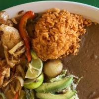 Plato De Pollo  · Grilled Chicken with a side of rice, beans, and tortillas.