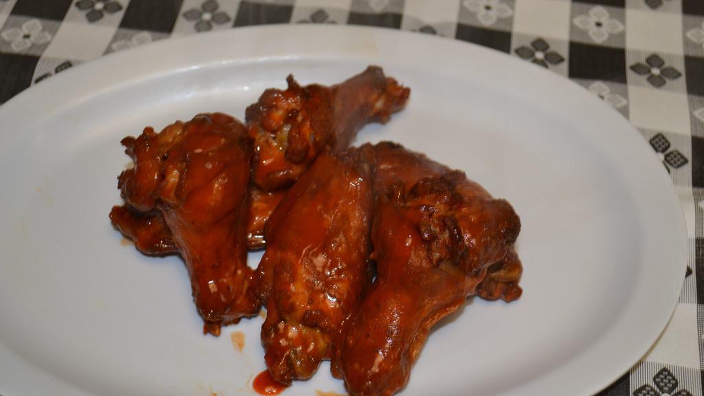 Buffalo Wings · 6 piece hot seasoned wings served with buffalo sauce and choice of ranch or blue cheese dipping sauce