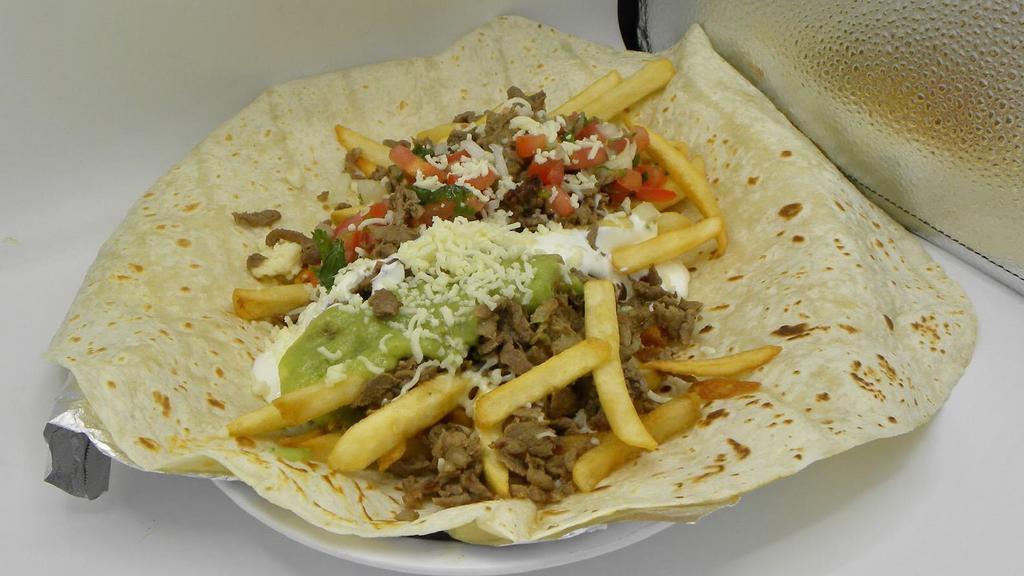 California Burrito · Filled with French fries, cheese, sour cream, guacamole, pico de gallo and your choice of meat.