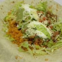 Veggie Burrito · Served with rice and beans, lettuce, pico de gallo, cheese, sour cream, and guacamole.