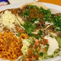 2 Tacos Plate · 2 Tacos with the meat of your choice served with rice and beans. Sour cream, Guacamole, and ...
