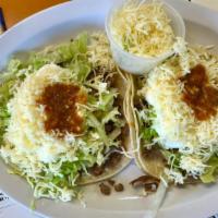 Super Tacos (EACH) · Served with your choice of meat, lettuce, sour cream, cheese and pico de gallo.