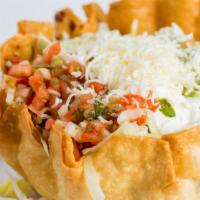Taco Salad · Served with choice of meat, fresh lettuce, beans, rice, guacamole, sour cream, cheese & pico...