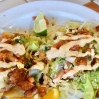 Taco de Pescado/Baja Fish Tacos · (Pescado) lightly battered fish, shredded lettuce, pico de gallo & a special & spicy tartar ...