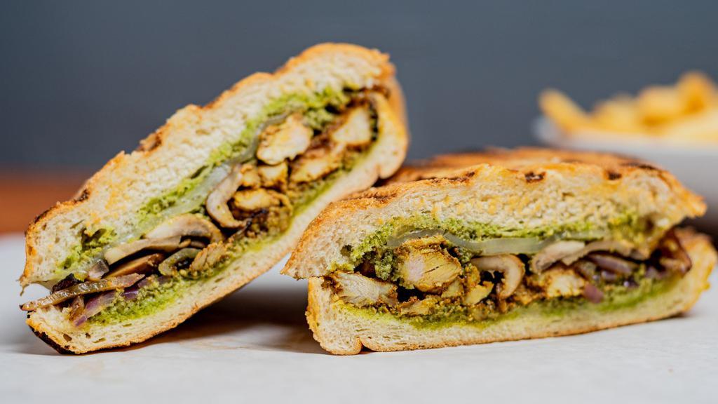 Chicken Pesto Panini · Chicken, pesto sauce, roasted mushroom, grilled onions, mozzarella cheese, and olive oil on your choice of focaccia bread.