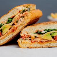 Turkey Avocado Panini · Turkey, mayo, provolone cheese, roasted red peppers, spinach avocado and olive oil on your c...