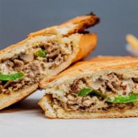 Philly Steak Panini · Beef steak, roasted mushrooms, roasted peppers, caramelized onions, garlic basil sauce, and ...