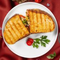 Vegetarian Panini · Roasted red bell peppers, grilled zucchini, spinach, tomatoes, and melted cheese on your cho...