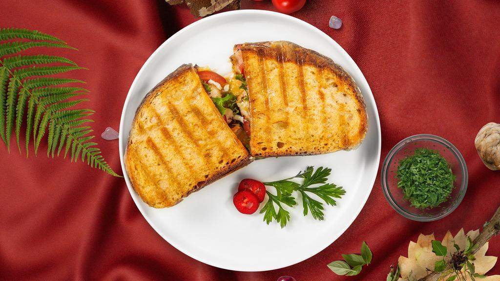 Vegetarian Panini · Roasted red bell peppers, grilled zucchini, spinach, tomatoes, and melted cheese on your choice of focaccia bread.