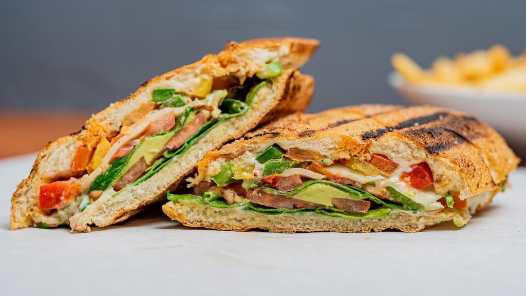 Panzanella Panini · Fresh spinach, tomato, avocado, roasted peppers, pesto garlic sauce, and provolone cheese on your choice of focaccia bread.