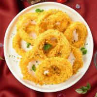 Onion Rings · (Vegetarian) Sliced onions dipped in a light batter and fried until crispy and golden brown.