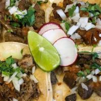 Tacos · Meat, onions, cilantro and salsa.