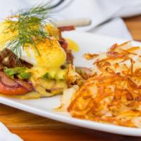 California Benedict · Grilled tomato, onion, bacon , two poached eggs on sourdough baguette. topped with hollandai...