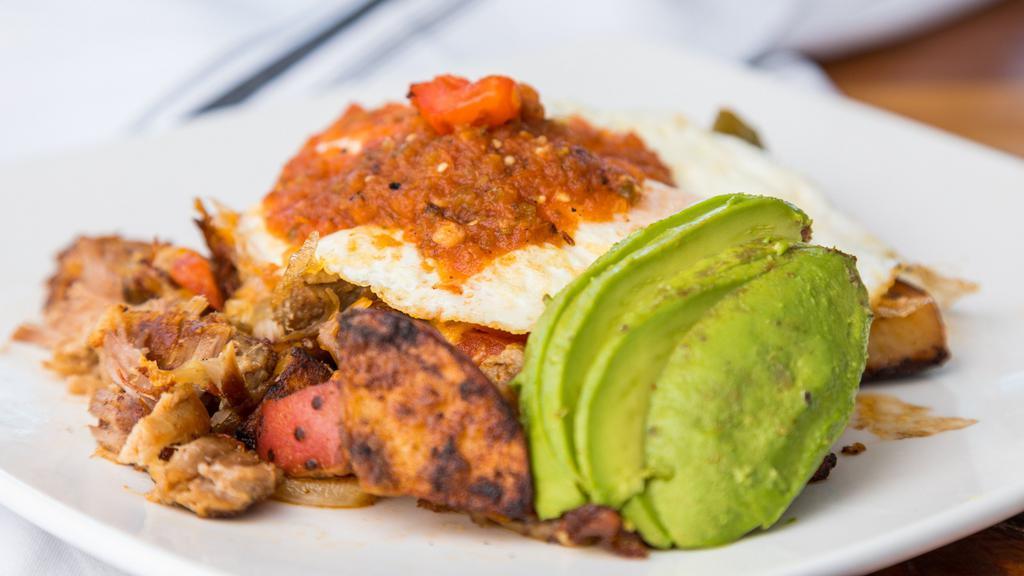 Carnitas Skillet · Seasoned country potatoes w/ tomato onion, cilantro, Cheddar cheese, Jack cheese topped with two eggs any style, house special salsa and avocado.