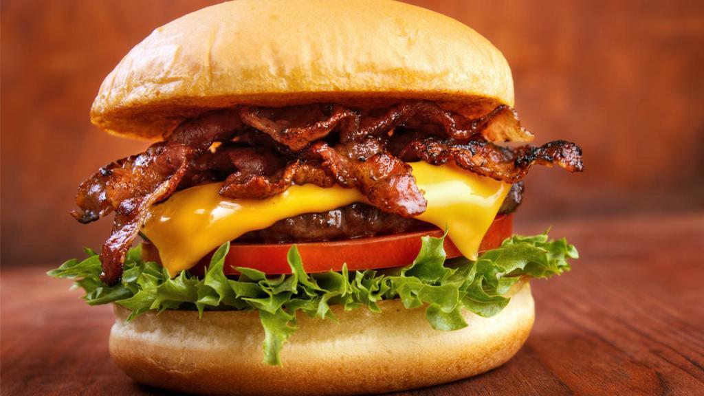 The Bacon Burger · 1/3 lb beef patty, crispy bacon, fresh lettuce, onions, and tomato, served on a french bread loaf.