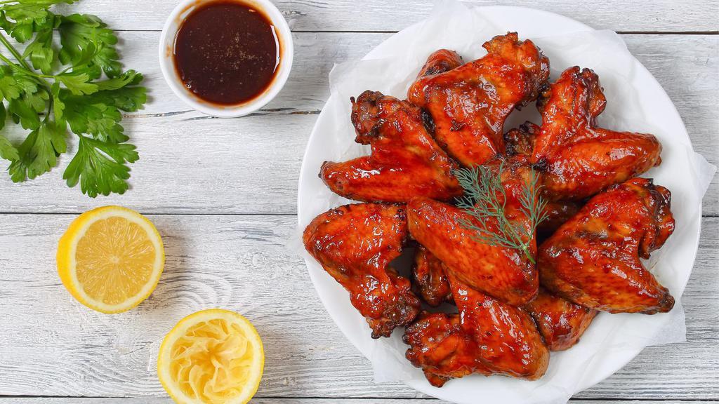 The Hot Honey BBQ Wings · Fresh chicken wings smothered in a sweet hot honey BBQ sauce.