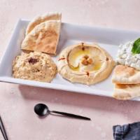 Mezze Platter (V) · Pita bread with sides of hummus, babaganoush, and tzatziki. Contains gluten, dairy, soy, and...