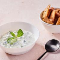 Tzatziki (V) · Includes a free side of pita chips. Contains gluten, dairy, and soy. We cannot make substitu...