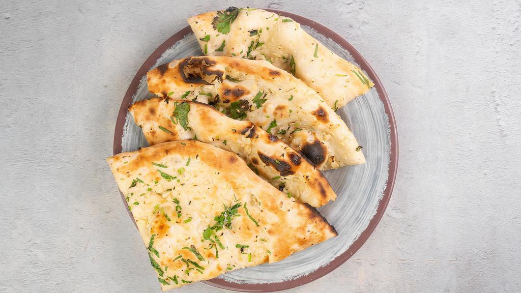 Garlic Naan by Zareen's · By Zareen's. Baked with minced garlic and cilantro sprinkle. Vegetarian. Contains gluten, dairy, and eggs. We cannot make substitutions.