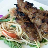 Papaya Salad with Beef Skewers · Tri-tip marinated with cambodian bbq sauce, char-broiled. Served with papaya salad. Papaya s...