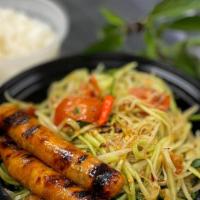 Papaya Salad with Curry Chicken Sausages · Angkor curry chicken sausages, char-broiled. Served with papaya salad. Papaya salad is mildl...
