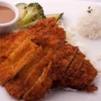 Chicken Katsu lunch · Breaded chicken served with  salad and rice.