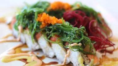 Monster · Inside: shrimp tempura, tuna, salmon, hamachi and avocado, outside: spicy tuna, seaweed salad and fish egg.