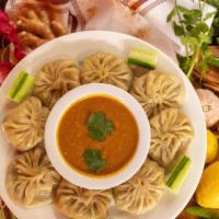Fried Paneer Momo(4 pieces) · Dumpling. Four piece. Deep fried dumplings filled with paneer and minced vegetables such as,...