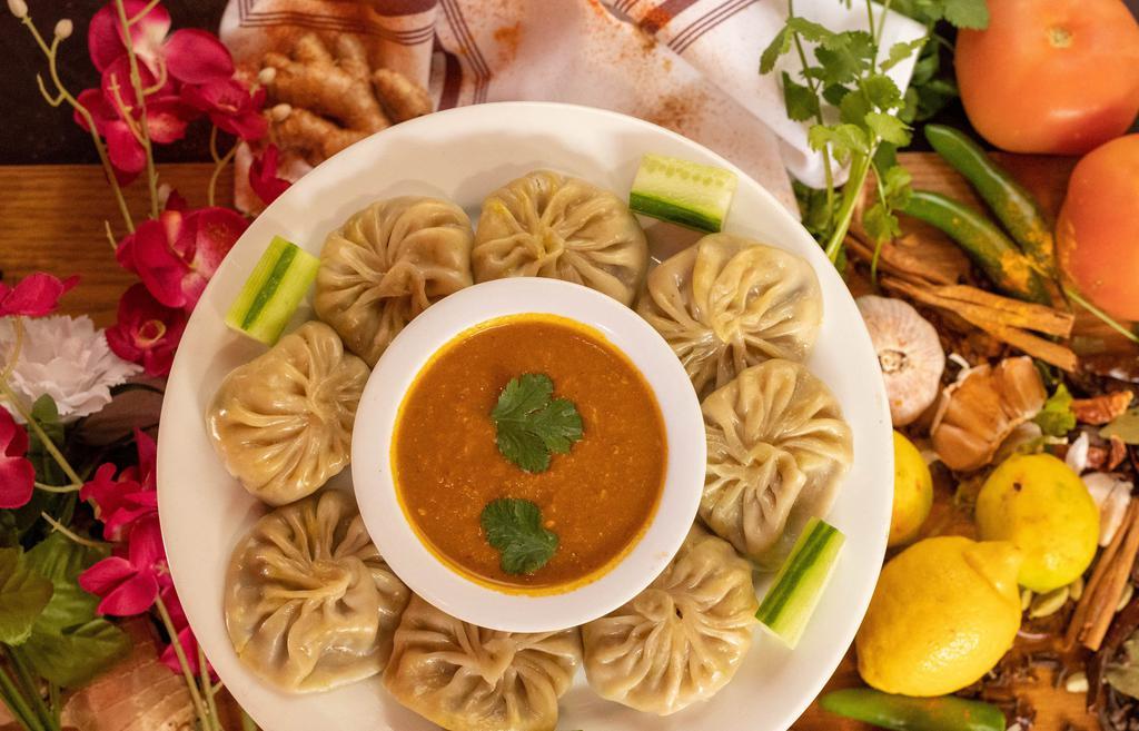 Fried Paneer Momo(4 pieces) · Dumpling. Four piece. Deep fried dumplings filled with paneer and minced vegetables such as, lettuce, onions and spices.