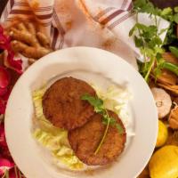 Aloo Tikki · Vegan. Two piece. Deep fried mashed potatoes with chickpeas flour.