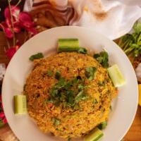 Chicken Biryani · Boneless chicken cooked with basmati rice curry sauce with biryani masala.