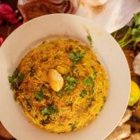 Vegetable Biryani · Varieties of vegetables cooked with basmati rice in curry sauce with biryani masala.