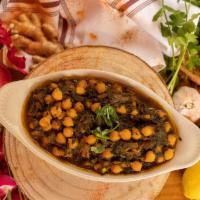 Chana Saag · Chickpeas cooked with minced spinach and fresh herbs.