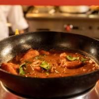 Chicken Curry · Boneless chicken cooked with ginger, garlic, onion and masala.