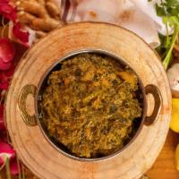 Chicken Saag · Boneless chicken cooked with minced spinach and fresh herbs.