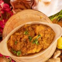 Fish Curry · Fish fillet of the day cooked in mild curry sauce with herbs and spices.