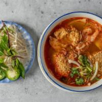 29 Ground Shrimp & Crab Meat , Rice Stick Soup/ Bún Riêu · Tomatoes soup with blended ground shrimp & crab meat.